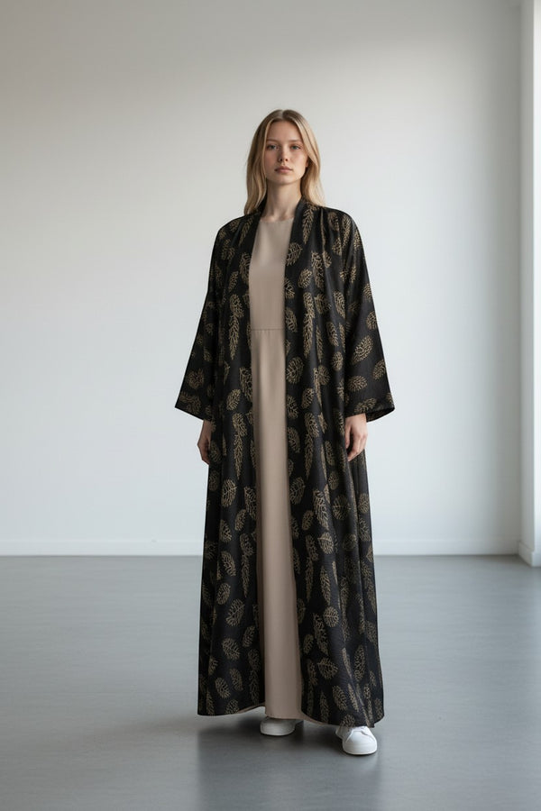 A&M FANCY STORE black abaya with gold leaf print, open-front, flowing fabric, elegant style.