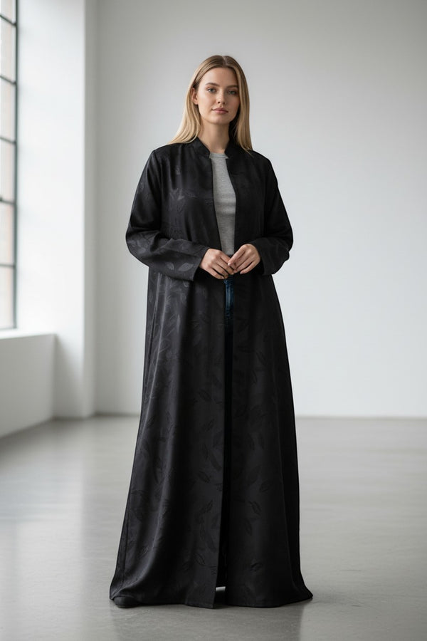 A&M Fancy Store black textured abaya with embossed leaf pattern and V-neckline, perfect for elegant modest wear.