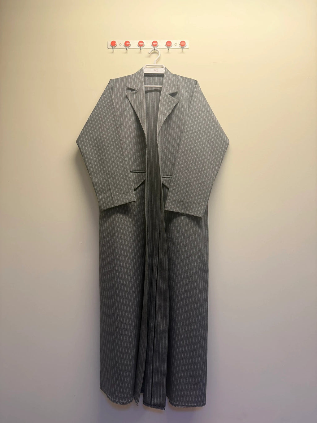 A&M FANCY STORE grey and white pinstripe longline blazer with lapel collar and flowing silhouette.